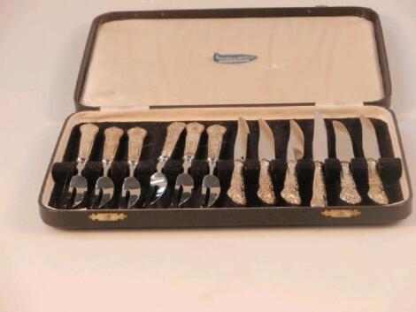 Six pairs of silver handled dessert knives and forks