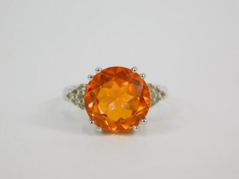 A silver Padparadscha quartz and white topaz ring, high claw set, quartz 6.22ct, size N/O, with certificate.