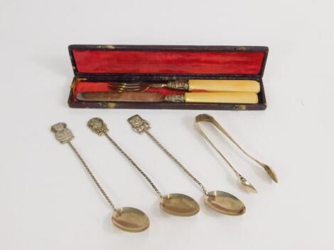 A Victorian silver travelling fruit knife and fork, with ivory handles, cased, George Unite, Birmingham 1839, a pair of silver sugar tongs, and three South American spoons.