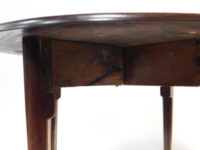 A George III figured mahogany oval drop leaf occasional table, supported on four slender tapered legs, with pad feet, 91cm x 100cm. - 4