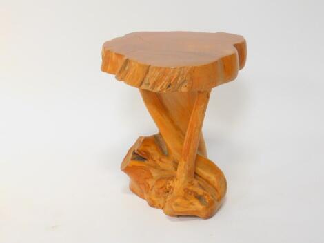 A carved driftwood stool or occasional table, 58.5cm H, 43cm Dia.