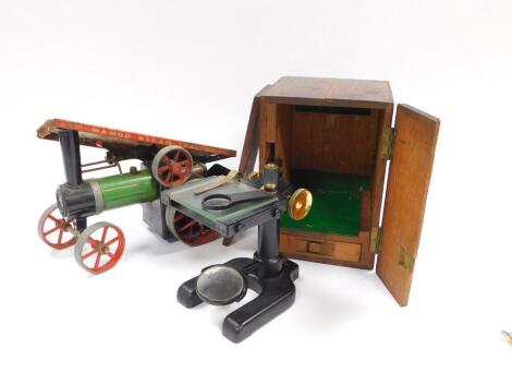 A W Watson & Sons Ltd microscope, No 81620, oak cased, together with a Mamod steam engine TE1A. (2)