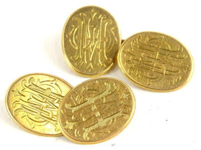 A pair of oval cufflinks, bearing the inscription HMW to each side, yellow metal, unmarked, marked C&K, 8.9g all in.