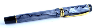 A Parker Duofold grey simulated marble and black fountain pen, with gold plated mounts, the nib stamped 18K 750.