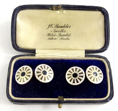 A pair of 9ct gold circular cufflinks, with black and white enamel design, markers stamp W.M & Co, boxed, 6.2g all in.