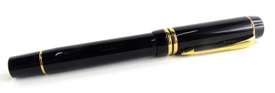 A Parker Duofold fountain pen in black, with gold plated bands, the nib stamped 18K 750.