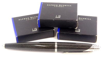 An Alfred Dunhill black carbon fibre torpedo shaped fountain pen, with brushed mounts, signed to the band, Alfred Dunhill and three boxes of Dunhill ink cartridges, possibly incomplete.