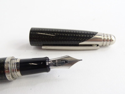 An Alfred Dunhill black carbon fibre torpedo shaped fountain pen, with brushed mounts, signed to the band, Alfred Dunhill and three boxes of Dunhill ink cartridges, possibly incomplete. - 2