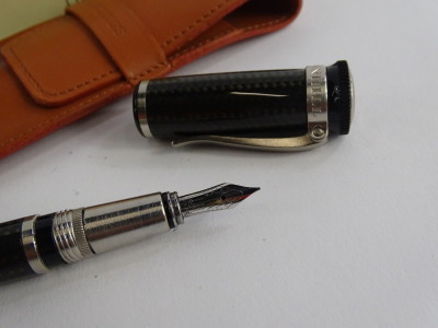 An Alfred Dunhill grey carbon fibre fountain pen, with brushed metal mounts signed to the hinged clip, and two packs of Dunhill ink cartridges, possibly incomplete, and a papyrus leather case. - 2