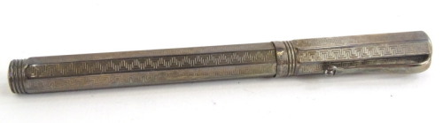 A silver Montegrappa fountain pen, with an engine turned Greek key design overall, the nib stamped 750, and with Greek key embellishment.