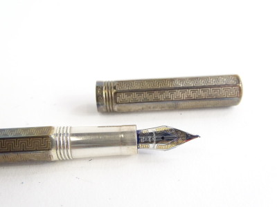 A silver Montegrappa fountain pen, with an engine turned Greek key design overall, the nib stamped 750, and with Greek key embellishment. - 2