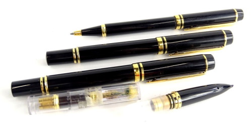 A collection of Waterman pens, each in black with gold mounts, to include a fountain pen, ball point and various parts of pens.