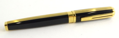 A Waterman black and gilt fountain pen, with fine engraved ribbed decoration, the nib stamped Ideal 18k 750.