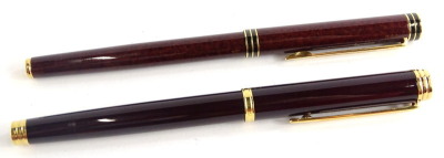 Two Waterman fountain pens, one with simulated brown speckled lacquer effect the other in dark brown, the nibs stamped 18k 750 and Ideal 18k 750 respectively.