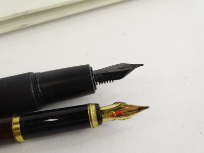 A Faber-Castell black and metal blackened steel fountain pen, with engine turned grip, and an Elysee fountain pen, etc. (2) - 2