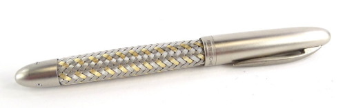 A Porsche Design Tec Flex steel and gold fountain pen, with part woven decoration, the nib stamped 750 M 18k.