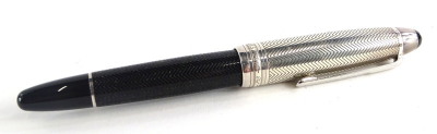 A Montblanc Meisterstuck Pix fountain pen, with engraved decoration to the black base, the top with similar decoration, possibly a model 146.