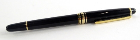 A Montblanc Meisterstuck black and gilt fountain pen, the nib stamped 14k 585.