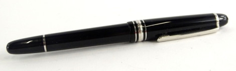 A Montblanc Meisterstuck black and silver fountain pen, the nib stamped AU 585.
