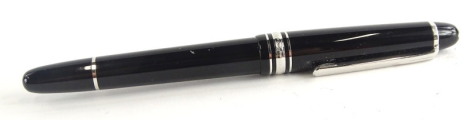 A Montblanc black and silver fountain pen, the nib stamped 585, personalised initials to cap.