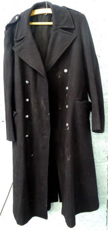 A Lincoln Corporation gentleman's overcoat, with engraved buttons, bars to the epaulettes or shoulders, possibly relating to a bus driver.