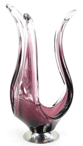 A Czech purple and clear glass centre piece, with shaped arms, on a polished aluminium base, 40cm high.