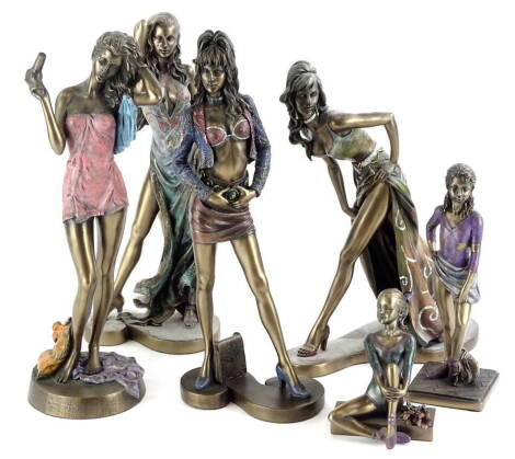 A collection of bronzed resin figures, each modelled in the form of a lady or young girl wearing brightly coloured clothing, embellished with glitter, etc. (6).