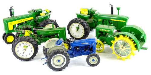 Four Danbury Mint novelty tractor clocks, each from the John Deere Clocks Collection, limited edition with some certificates and a Danbury Mint Ford 2000 tractor (5).