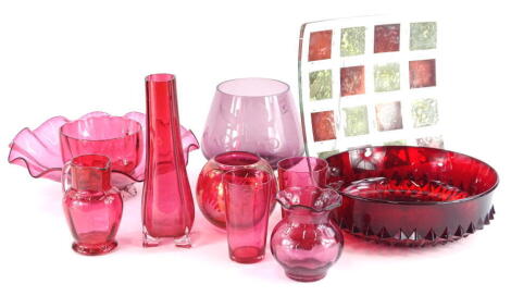 A collection of coloured glass, to include a Victorian cranberry tinted bowl with petallated border, cranberry tinted jug, Studio glass dish decorated with squares, etc.