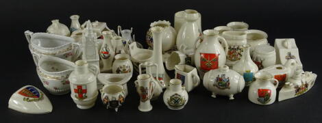 A collection of Goss and other crested china, to include a teapot stand, various ancient vessels, etc.