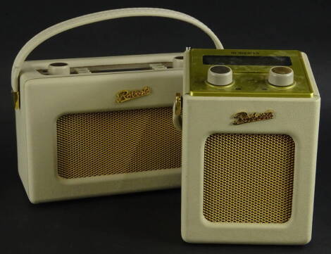 Two cream Roberts portable radios.