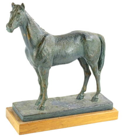 Marshall. A figure of a horse, bronzed, resin, signed to the rectangular base, mounted on a hardwood plinth, 38cm wide.