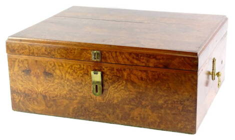 A continental rectangular burr walnut box, the hinged lid enclosing a vacant interior, with later adapted side handles, possibly previously containing a polyphon, 45cm wide.