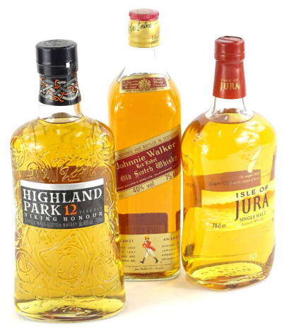 Three bottles of whisky, Highland Park, 12 years, Isle of Jura, 10 years and Johnnie Walker red label.