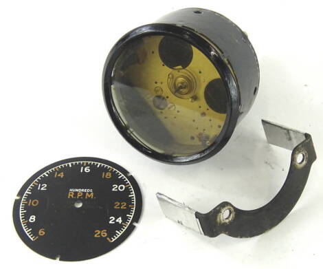 An early and rare Smiths MK162 tachometer, with a circular Arabic dial, marked 100's rpm, in a black metal casing, 9cm diameter.