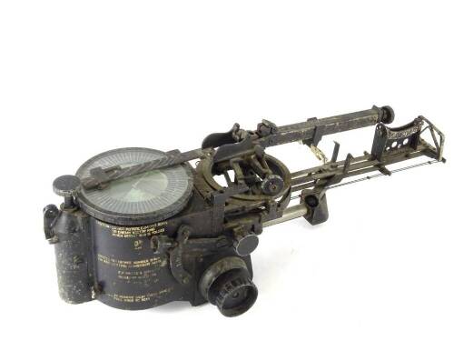 A Second World War bomb sight, by E.R Watts and Sons of Manchester, with a circular dial, lacking interior levelling liquid, various measuring scales etc. Air Ministry mark and indistinct stores and mark number, serial number 4020/35, 58cm long.