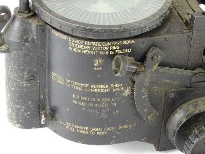 A Second World War bomb sight, by E.R Watts and Sons of Manchester, with a circular dial, lacking interior levelling liquid, various measuring scales etc. Air Ministry mark and indistinct stores and mark number, serial number 4020/35, 58cm long. - 2