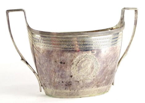 A George IV silver two handled sugar bowl, with engine turned bands, a central leaf cartouche bearing initials ES to one side, the reverse GA with angular handles, London 1926, 7¼ oz.