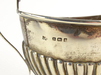 A George V silver part fluted two handled sugar bowl, and a matching milk jug, Birmingham 1910, 4½oz. - 2