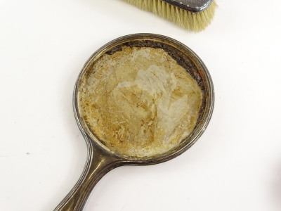 Various silver mounted dressing table items, to include an engine turned hand mirror, lacking mirror plate, and various brushes, (AF). - 2