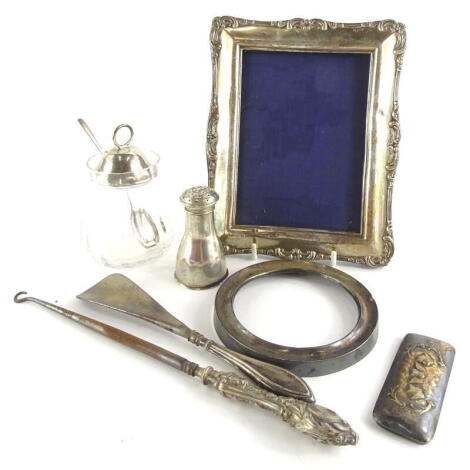 Various silver and silver mounted items etc., to include frames, button hooks, shoe horn, pepper pot, etc.