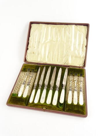 A late Victorian silver plated part dessert service, each blade engraved with flowers, leaves, etc., mounted with mother of pearl handle, comprising five forks and six knives (incomplete), in red leatherette and velvet lined box.