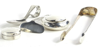 A collection of small silver items, to include a portable ash tray, a child's spoon, pill box, sugar tongs, and a baby pusher, 3¼oz.