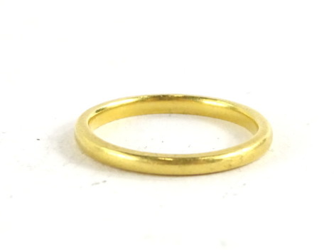 A 22ct gold thin wedding band, (misshapen) 2.3g all in.