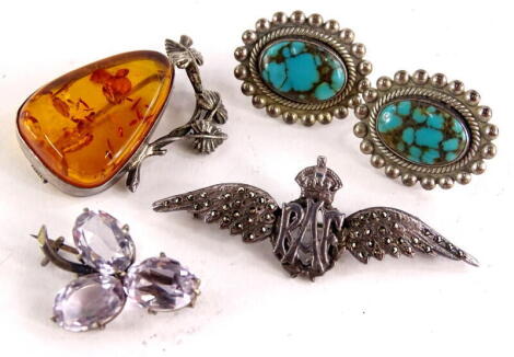 A small quantity of silver and other jewellery, comprising an imitation amber and silver vine brooch, a pair of screw on earrings with central blue stone, marked to the rear Sterling, a three leaf clover design silver plated frame brooch and an RAF marcas