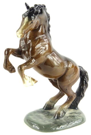 A Beswick rearing horse, number 1014, brown colourway, marks beneath, 25cm high.