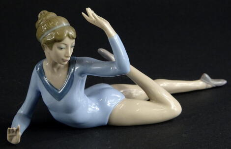 A Lladro figure of a recumbent ballerina, B-123, printed and impressed marks beneath, 23cm wide.