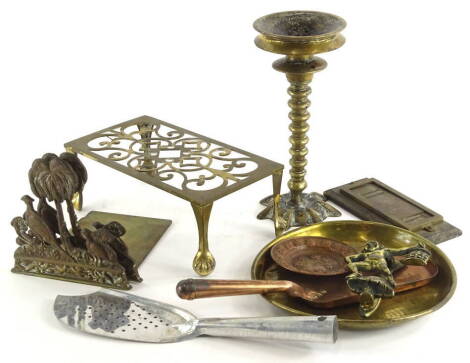 Various metalware, early 20thC and other, a trivet of rectangular form, 27cm wide, various other metalware, an entwined Eastern candlestick, bookends, crumb scoop, etc. (a quantity).