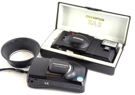 An Olympus MJU Zoom 105 camera, a further Olympus A11 XA2 camera, 13cm wide, in fitted case (2).