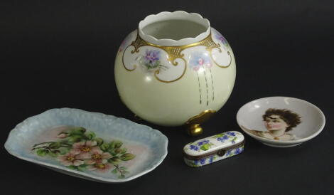 A 20thC Limoges globular bowl, with gilt highlights, marked J F E, 14cm diameter and a Limoges enamel box of oblong form, decorated with flowers, metal highlights, an unmarked saucer set with a profile of a lady, etc., (4).